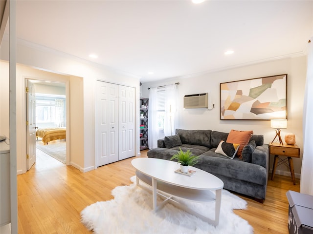 94 Shadyside Ave, Port Washington, NY 11050 - living room with crown molding, light wood finished floors, a wall unit AC, baseboards, and recessed lighting