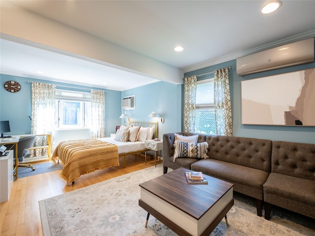 94 Shadyside Ave, Port Washington, NY 11050 - bedroom featuring a wall unit AC, crown molding, an AC wall unit, an office area, and light wood finished floors