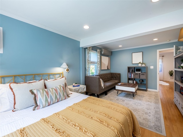 94 Shadyside Ave, Port Washington, NY 11050 - bedroom featuring crown molding, recessed lighting, wood finished floors, a wall unit AC, and baseboards