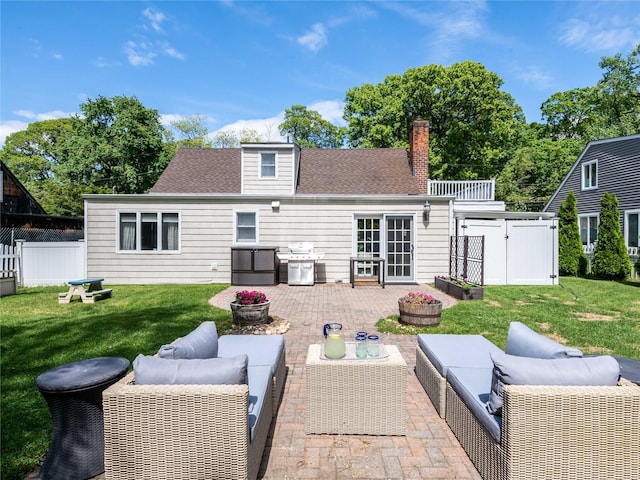 94 Shadyside Ave, Port Washington, NY 11050 - rear view of house featuring a patio area, outdoor lounge area, a chimney, and roof with shingles