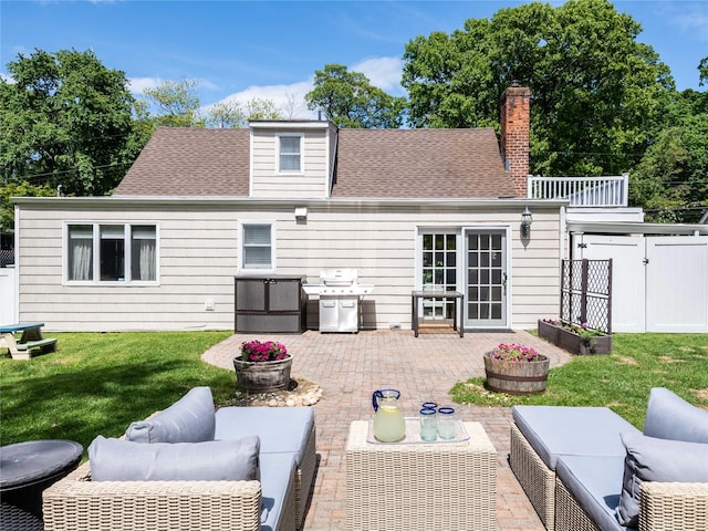 94 Shadyside Ave, Port Washington, NY 11050 - back of house with an outdoor living space, a patio area, and a chimney
