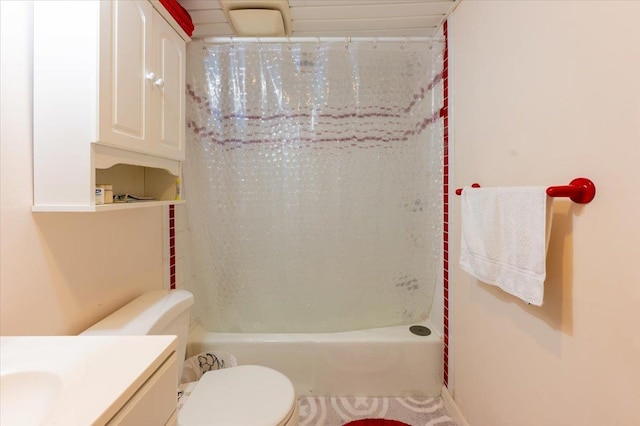 bathroom featuring toilet, shower / tub combo with curtain, and vanity