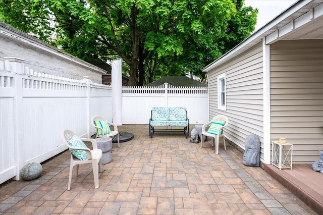 view of patio featuring fence