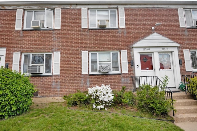 townhome / multi-family property with brick siding