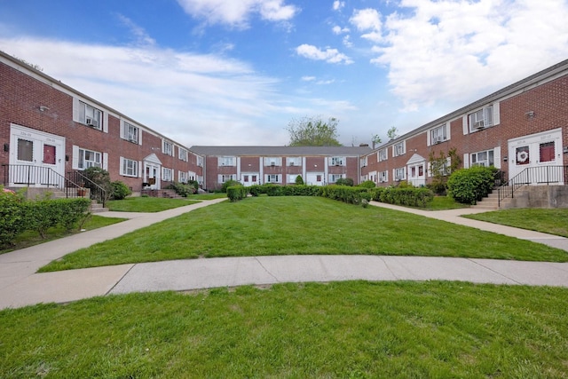 view of home's community with a residential view and a yard