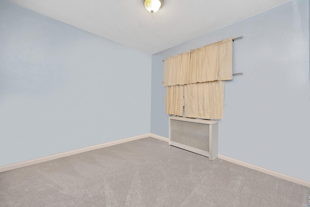 empty room with light carpet and baseboards
