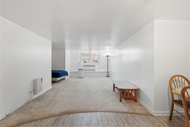 110-20 71st Ave Unit 106, Forest Hills, NY 11375 - interior space featuring radiator, wood finished floors, baseboards, and carpet floors