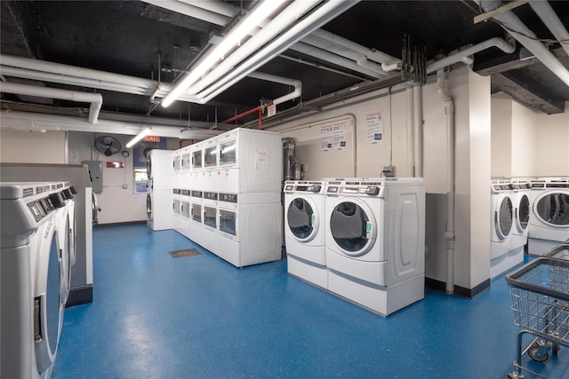 110-20 71st Ave Unit 106, Forest Hills, NY 11375 - shared laundry featuring washer and clothes dryer, electric panel, and stacked washer / drying machine