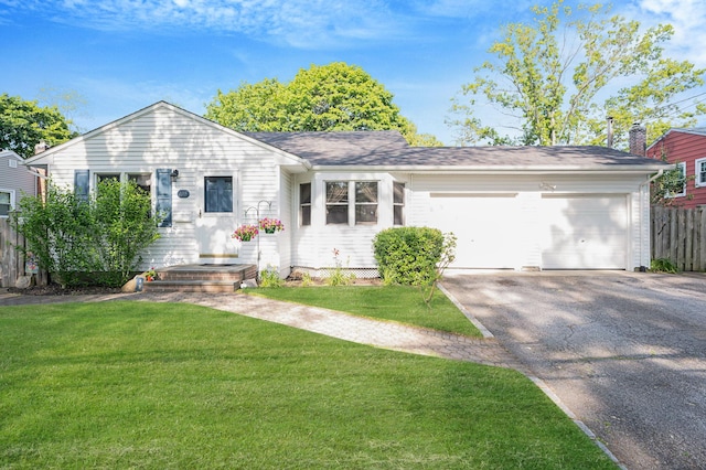105 1st Ave, Kings Park, NY 11754 - view of front of property featuring driveway and an attached garage