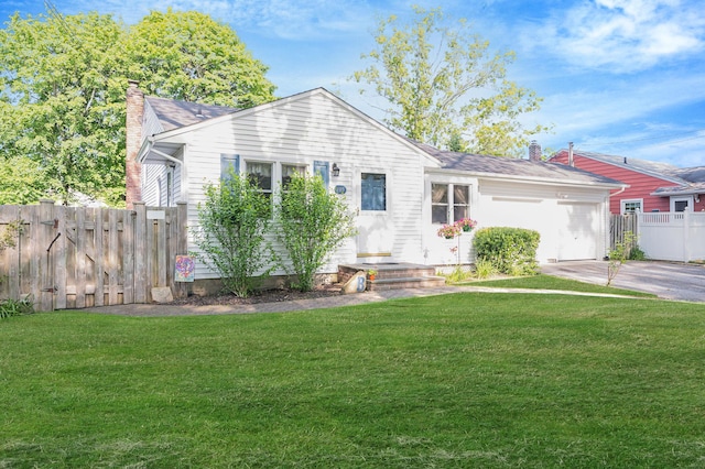 105 1st Ave, Kings Park, NY 11754 - view of front of property with a chimney, driveway, and an attached garage