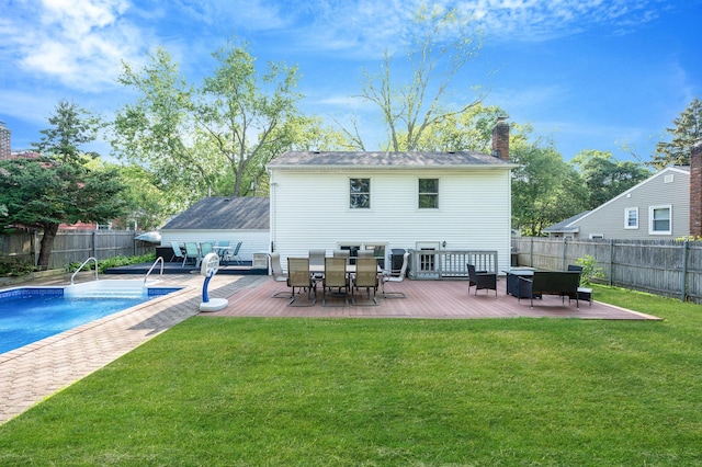 105 1st Ave, Kings Park, NY 11754 - back of property with a deck, a fenced backyard, outdoor dining space, and a chimney