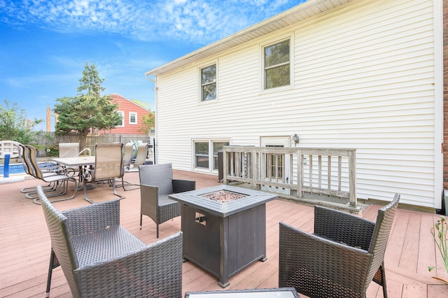 105 1st Ave, Kings Park, NY 11754 - wooden terrace with a fire pit and outdoor dining space