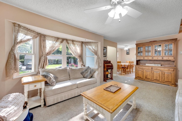 105 1st Ave, Kings Park, NY 11754 - living room with a ceiling fan, a textured ceiling, and light colored carpet