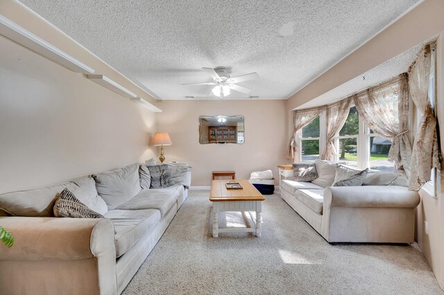 105 1st Ave, Kings Park, NY 11754 - living area featuring a textured ceiling, ceiling fan, and carpet flooring
