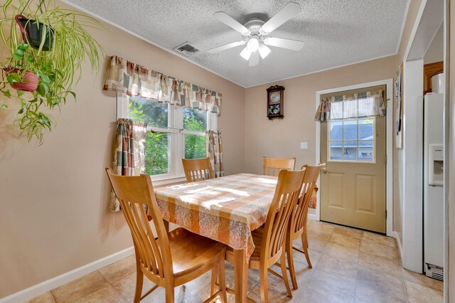 105 1st Ave, Kings Park, NY 11754 - dining area with a textured ceiling, ceiling fan, and light tile patterned floors