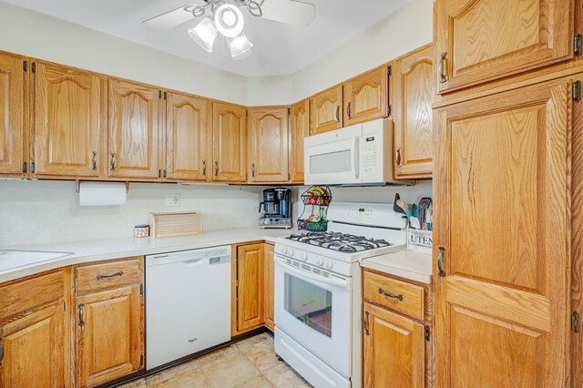 105 1st Ave, Kings Park, NY 11754 - kitchen featuring white appliances, a ceiling fan, and light countertops