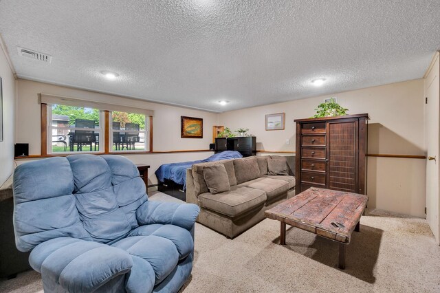 105 1st Ave, Kings Park, NY 11754 - carpeted living area featuring a textured ceiling, recessed lighting, and a baseboard radiator