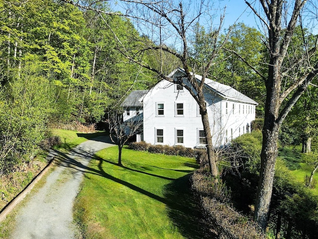 2182 Old Rte 17, Roscoe, NY 12776 - view of front facade with asphalt driveway, a front yard, and a wooded view