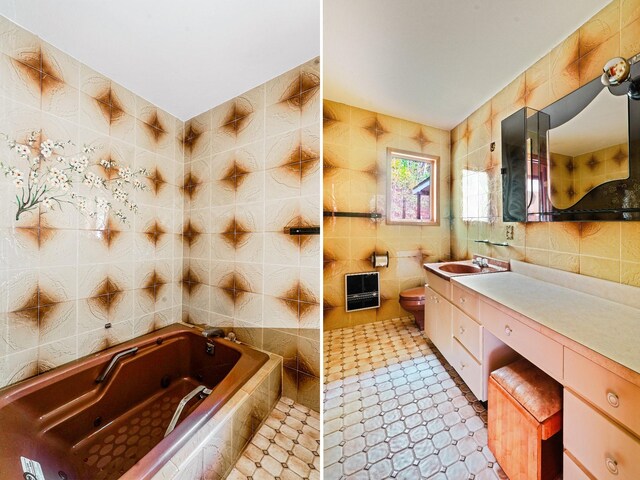 2182 Old Rte 17, Roscoe, NY 12776 - bathroom featuring tile walls, a jetted tub, toilet, and vanity