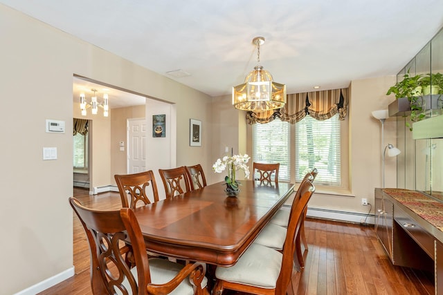 10 Northwood Ct, Dix Hills, NY 11746 - dining room featuring a chandelier, baseboard heating, wood-type flooring, and baseboards