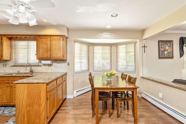 10 Northwood Ct, Dix Hills, NY 11746 - dining area with a baseboard heating unit, light wood-type flooring, ceiling fan, baseboards, and recessed lighting