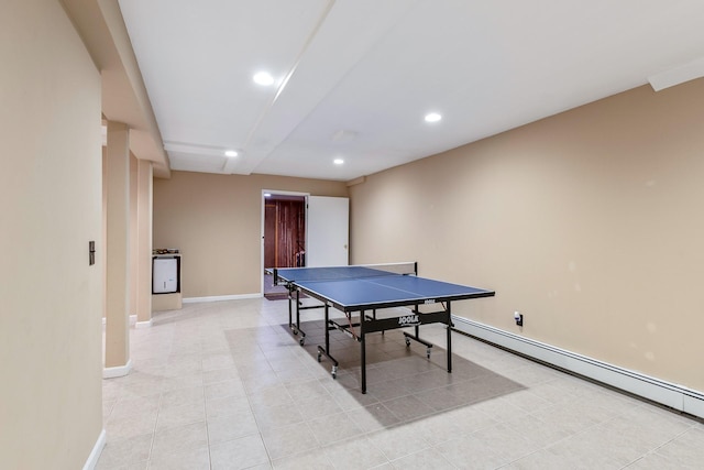 10 Northwood Ct, Dix Hills, NY 11746 - recreation room with a baseboard radiator, recessed lighting, baseboards, and light tile patterned floors