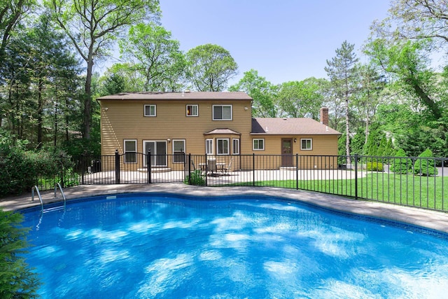 10 Northwood Ct, Dix Hills, NY 11746 - view of swimming pool featuring a patio area and view of scattered trees