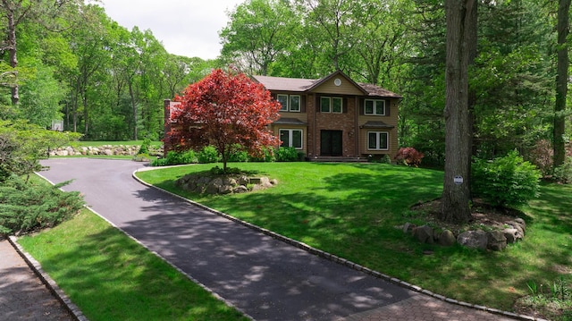 10 Northwood Ct, Dix Hills, NY 11746 - view of front facade with a front lawn