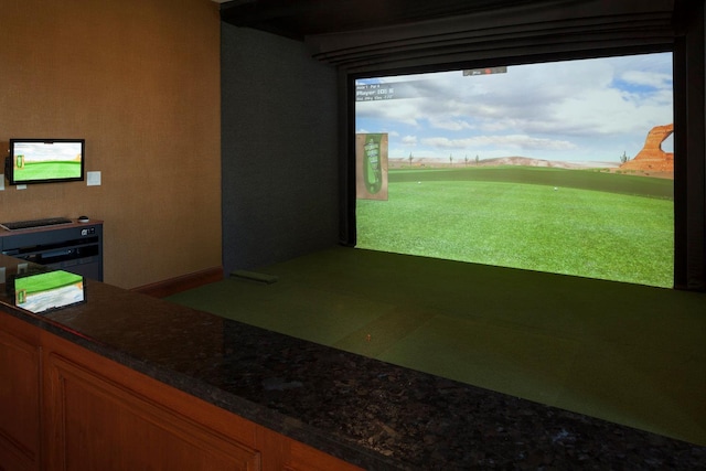 game room with golf simulator