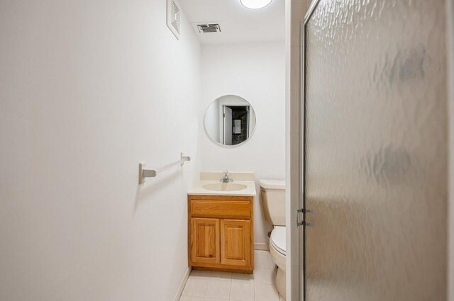 12 Glenn Pl, Hastings-On-Hudson, NY 10706 - full bath featuring vanity, toilet, tile patterned floors, a shower with shower door, and baseboards