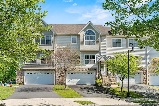 40 Peter Turner Rd, Monroe, NY 10950 - townhome / multi-family property featuring stone siding, driveway, and a garage