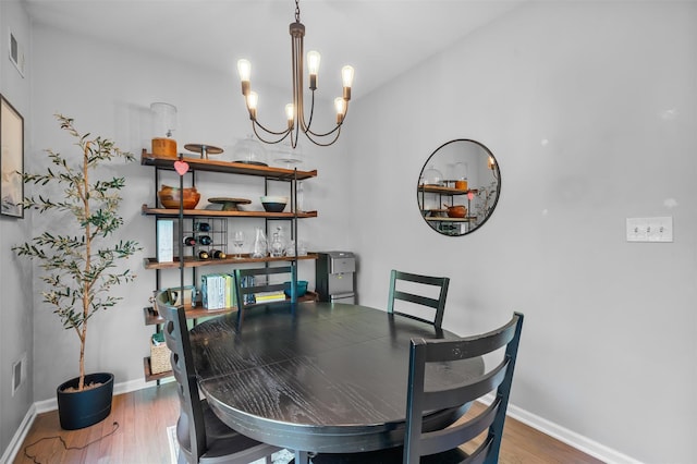 40 Peter Turner Rd, Monroe, NY 10950 - dining space featuring a chandelier, wood finished floors, and baseboards