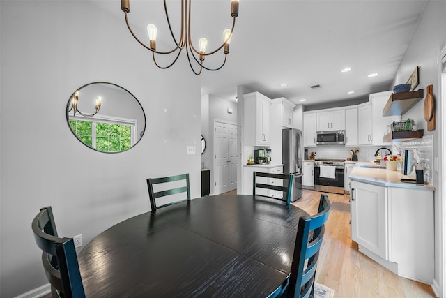 40 Peter Turner Rd, Monroe, NY 10950 - dining room featuring a chandelier, light wood-type flooring, and recessed lighting