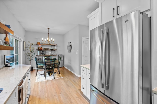 40 Peter Turner Rd, Monroe, NY 10950 - kitchen featuring freestanding refrigerator, light wood-type flooring, a chandelier, white cabinetry, and open shelves