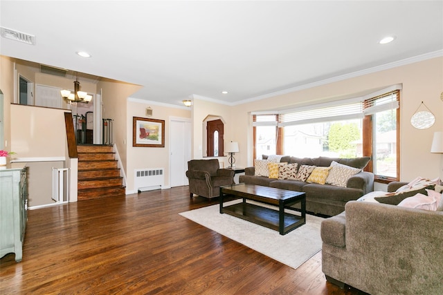 living area featuring radiator heating unit, dark wood-style flooring, crown molding, a chandelier, and recessed lighting