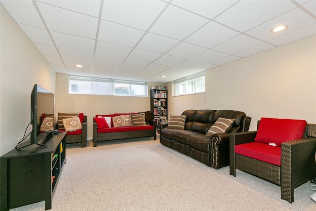 carpeted living area featuring recessed lighting and a paneled ceiling
