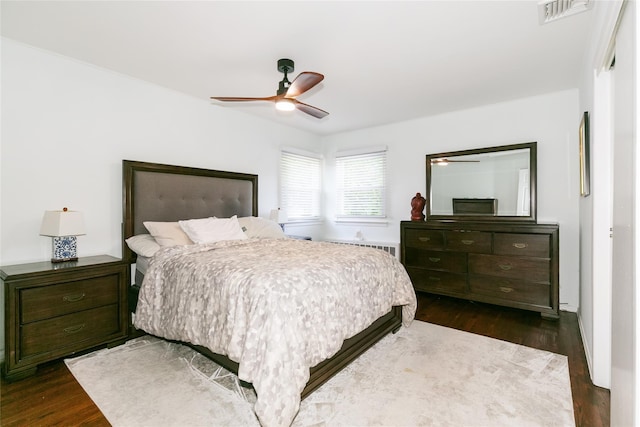 bedroom with dark wood finished floors and a ceiling fan