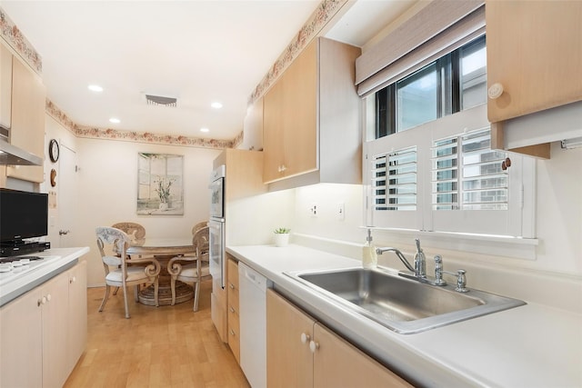 16 Waters Edge Unit 16, Rye, NY 10580 - kitchen with dishwasher, a sink, light countertops, light wood-type flooring, and recessed lighting