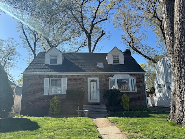 342 Garfield Ave, West Hempstead, NY 11552 - cape cod home featuring brick siding, roof with shingles, and a chimney