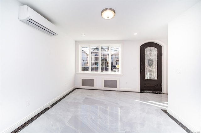 entryway featuring a wall mounted air conditioner, light marble finish floors, baseboards, and recessed lighting