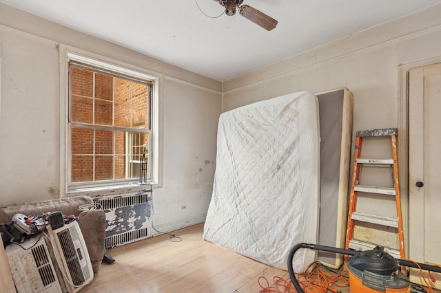 117-01 Park Ln S Unit C 1F, Kew Gardens, NY 11418 - spare room featuring wood finished floors, ceiling fan, and radiator heating unit