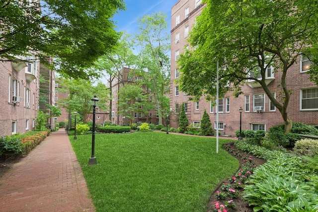 117-01 Park Ln S Unit C 1F, Kew Gardens, NY 11418 - surrounding community with a yard