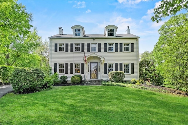 70 Willow Ln, New Windsor, NY 12553 - view of front facade featuring a chimney and a front yard