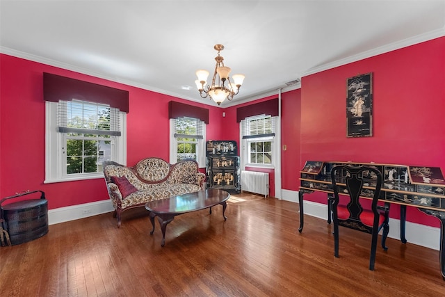 70 Willow Ln, New Windsor, NY 12553 - dining area with radiator, a chandelier, wood finished floors, baseboards, and crown molding