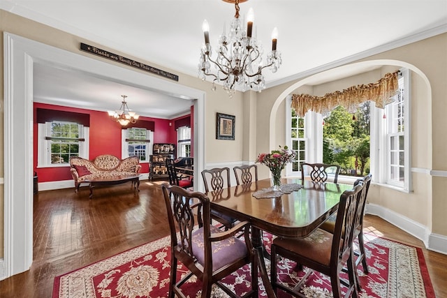 70 Willow Ln, New Windsor, NY 12553 - dining room with a chandelier, arched walkways, baseboards, wood finished floors, and crown molding