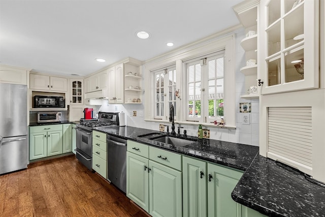 70 Willow Ln, New Windsor, NY 12553 - kitchen with appliances with stainless steel finishes, open shelves, a sink, green cabinetry, and decorative backsplash