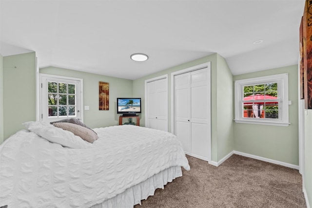 70 Willow Ln, New Windsor, NY 12553 - carpeted bedroom with multiple closets, vaulted ceiling, and baseboards