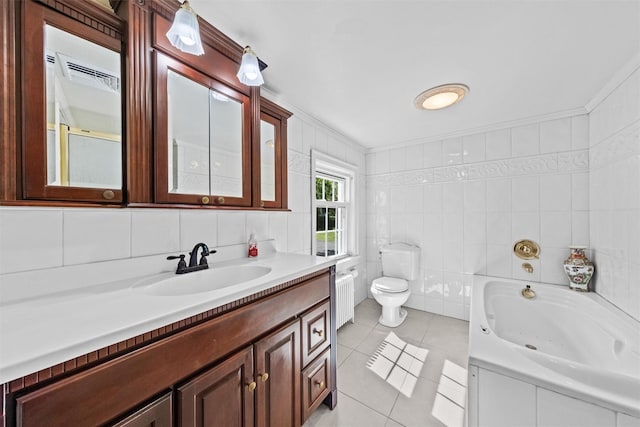 70 Willow Ln, New Windsor, NY 12553 - full bathroom featuring radiator, tile patterned floors, toilet, vanity, and a garden tub