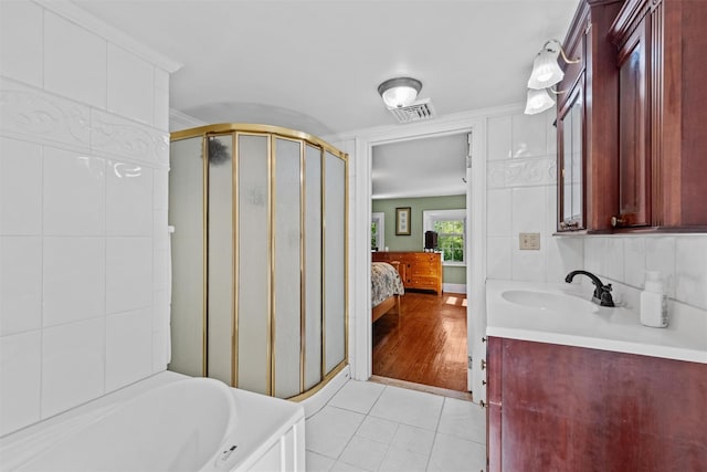 70 Willow Ln, New Windsor, NY 12553 - full bath featuring a stall shower, tile patterned flooring, ensuite bathroom, vanity, and a bath