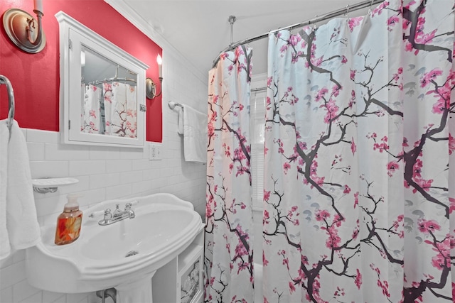 70 Willow Ln, New Windsor, NY 12553 - full bathroom featuring crown molding, tile walls, a shower with curtain, and a wainscoted wall